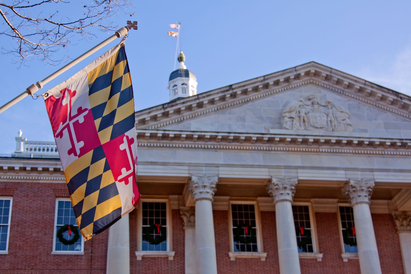 Maryland flag flying in front of the State House in Annapolis, MD