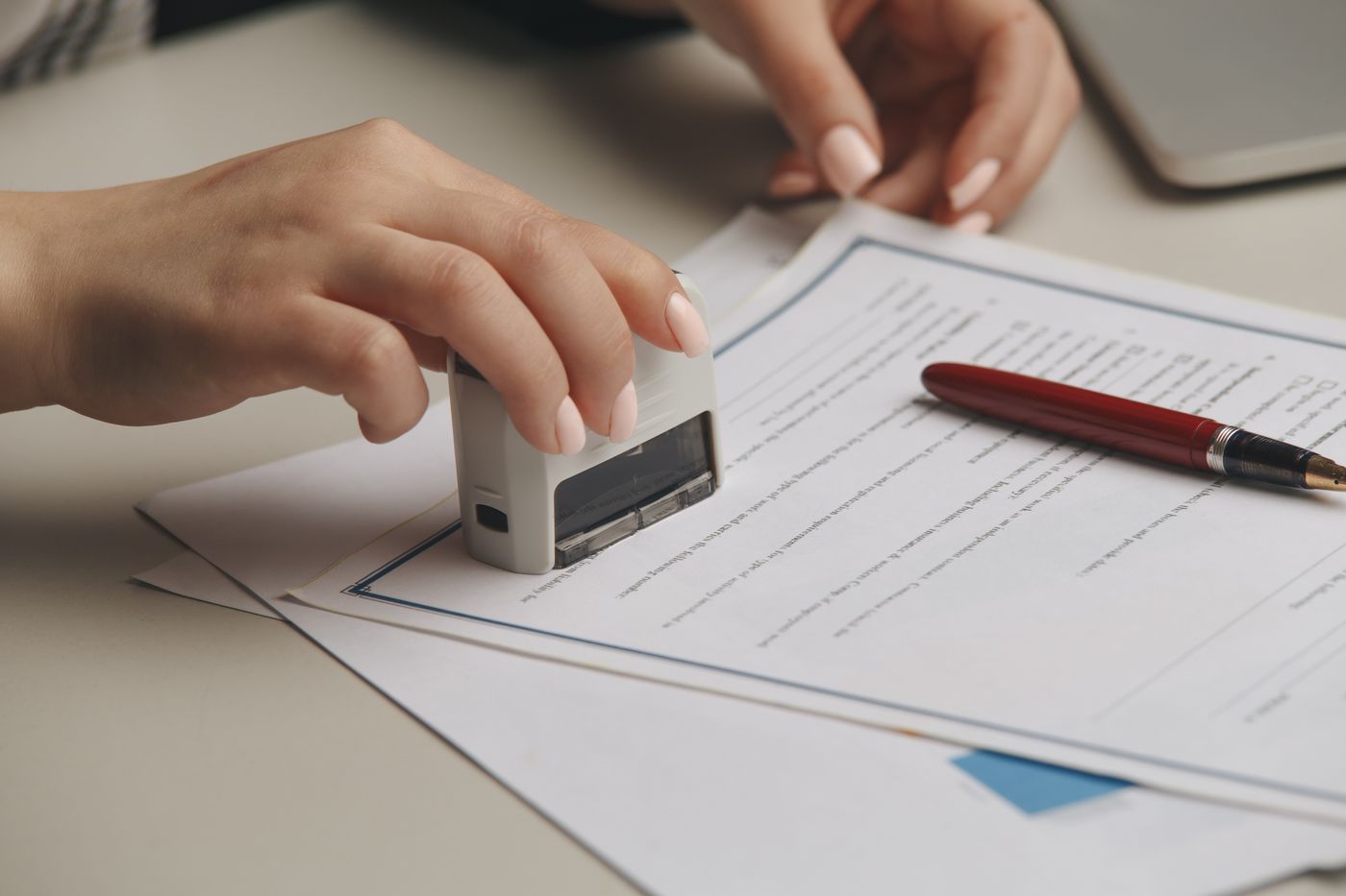Notary stamping a signed document during an appointment